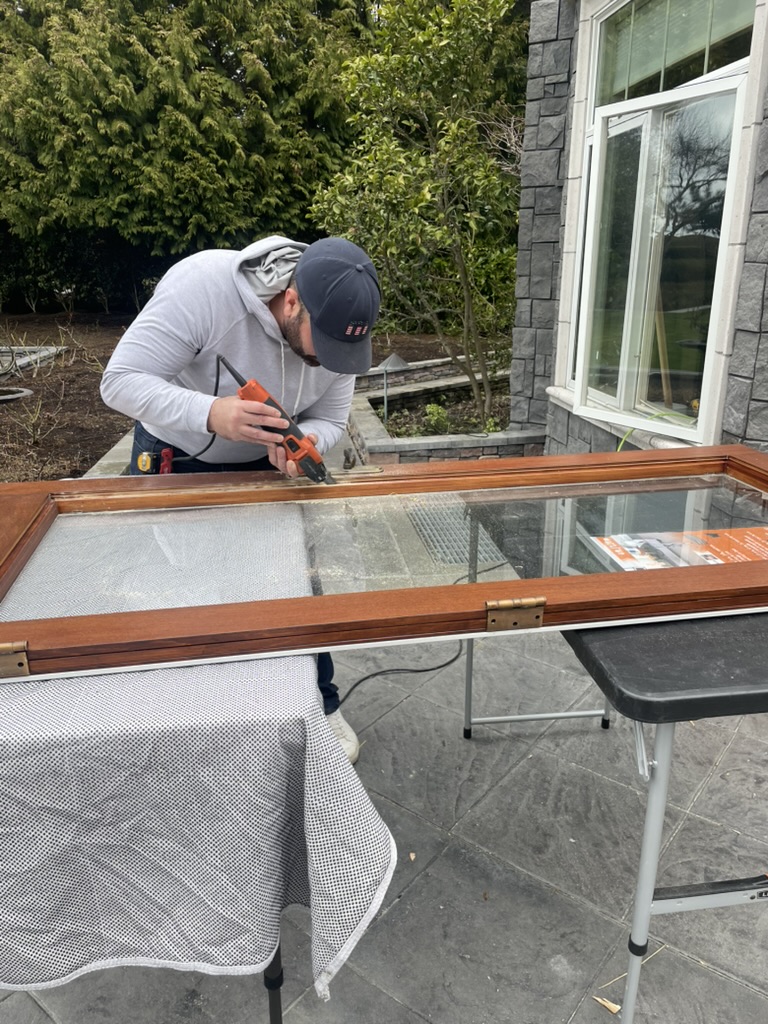 The old glass comes out. We keep the wood sash.